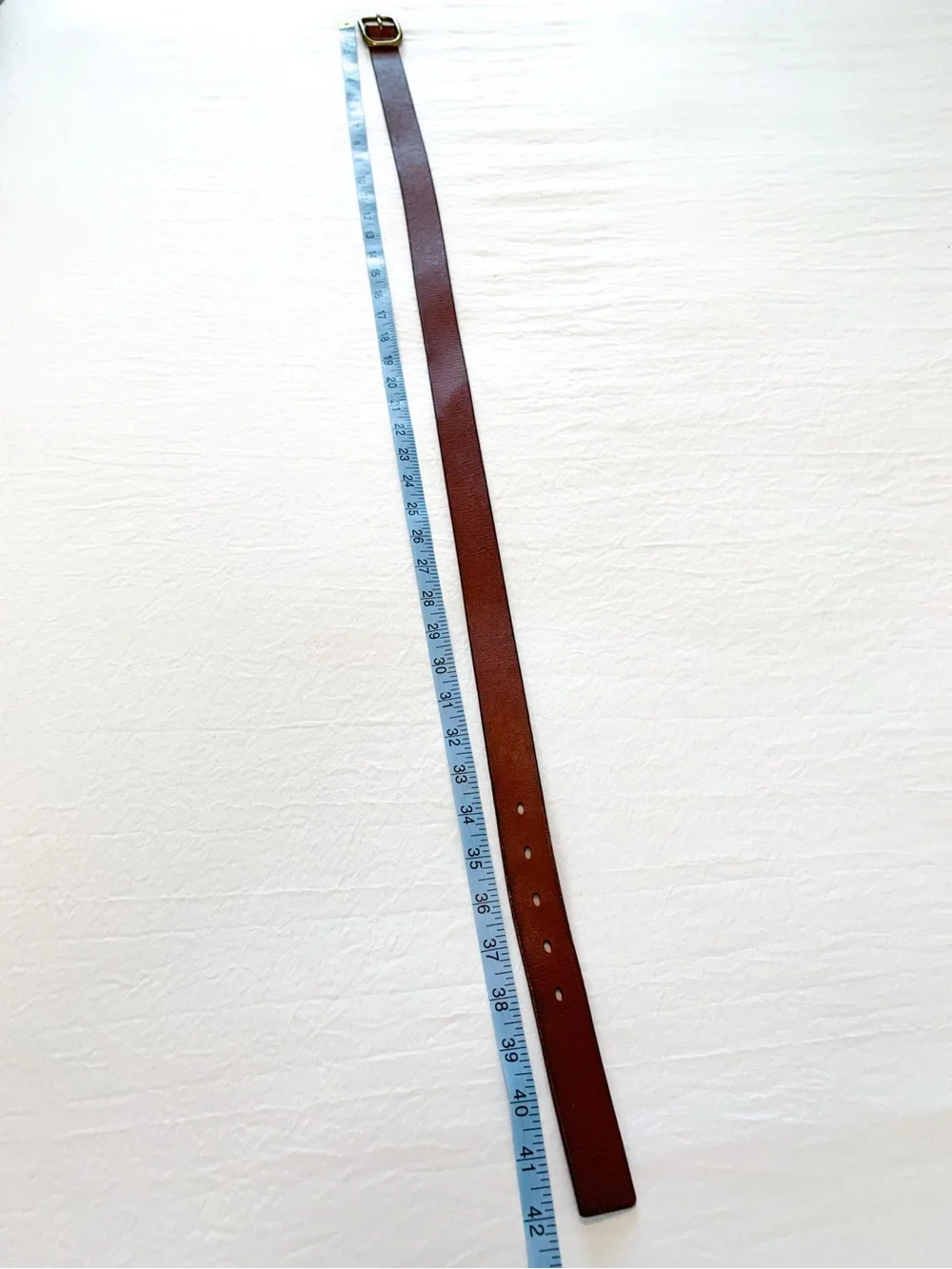 Gap leather belt in cognac red-brown color with brass tone buckle, medium